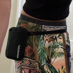 black LULULEMON crossbody fanny pack with adjustable straps